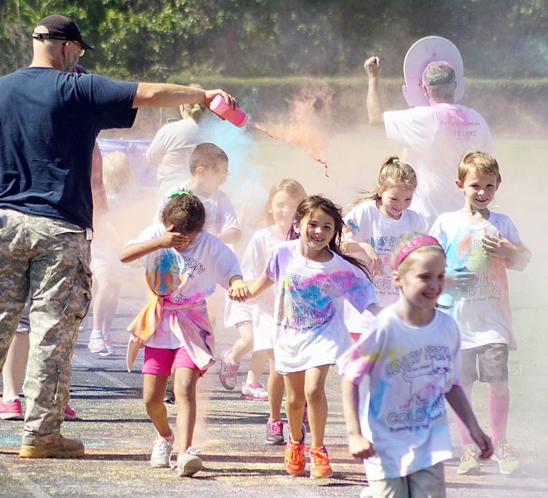 Photo by Randy Moll It was a colorful day on Friday at Gentry Primary School because students ran around the track and were doused with colors in the fourth annual Color Run, a fundraising effort for the primary school PTO.