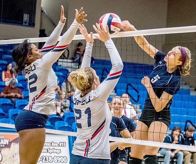 Photo courtesy of JBU Sports Information John Brown sophomore middle hitter Jessica Meyer hammers home a kill Saturday against Oklahoma Panhandle State in JBU's 3-0 win at Bill George Arena.