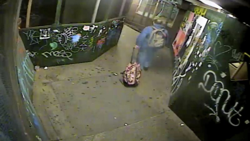 In this image taken from a Sept. 17, 2016, surveillance video and provided by the United States Attorney's Office, Ahmad Khan Rahimi pulls a suitcase believed by prosecutors to be containing a pressure cooker bomb in New York. The trove of digital evidence in Rahimi's ongoing federal trial is meant to provide airtight proof he was behind a 2016 attack, but it also dramatically demonstrates the growing omnipresence of security cameras. (Courtesy of the United States Attorney's Office via AP)