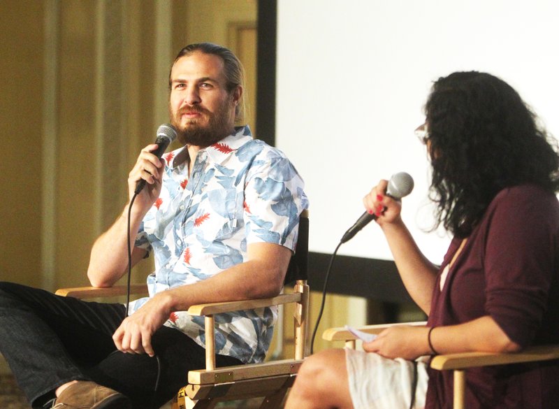 The Sentinel-Record/Richard Rasmussen STATE OF MIND: Cinematographer Chapin Hall, left, discussed his work on the documentary film, "Out of State," with volunteer Sheryl Santacruz Tuesday after its showing for the 26th annual Hot Springs Documentary Film Festival at the Arlington Resort Hotel & Spa.