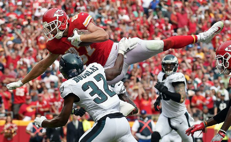 Kansas City tight end Travis Kelce (top) is one of several players battling injuries, but that hasn’t stopped the Chiefs from a 5-0 start to the season. 