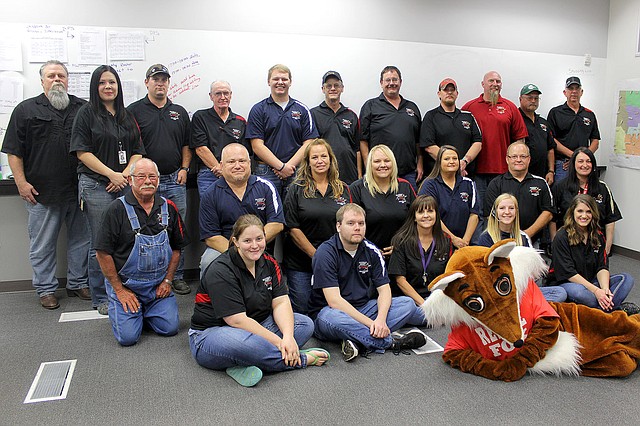 MEGAN DAVIS MCDONALD COUNTY PRESS/The people behind the scenes, dispatchers and board members of the 911 Emergency Center. Back row, L to R: John Wynn, Julie Thomas, Eastern Board Member Kurt Williams, Board Chairman Richard Huston, Hunter Lyons, Western Board Member Ted Huston, Kelly Johnson, Eric Raney, Chris Owens, Eastern Board Member Darrel Watson and Western Board Member Dewey Pierce. Middle, L to R: Eastern Board Member Calvin Wilson, Ellsworth Amos, Sam Martineau, Tracy Owen, Director Lisa McCool-Rataczak, Bill Thomas, and Stephanie Gilmore. Front, L to R: Sara Pierson, Ross Ahrens, Shelly Porter, Khaylea Owens, Danielle Duncan and Rescue Fox. (Not pictured: Vice Chairman Robert Evenson, Loren Proctor, and Eric Stelts.)