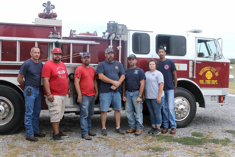MEGAN DAVIS MCDONALD COUNTY PRESS/Volunteers with the Southwest City Fire Department, L to R: Chief Shane Clark, Nathan Womack, Jordan Wallace, Jerry Ware, Brent &quot;Wormie&quot; Blake, Tracy Jackson and Ron Jackson.
