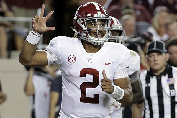 Alabama quarterback Jalen Hurts (2) celebrates after rushing for a touchdown against Texas A&M during the second quarter of an NCAA college football game Saturday, Oct. 7, 2017, in College Station, Texas. (AP Photo/David J. Phillip)

