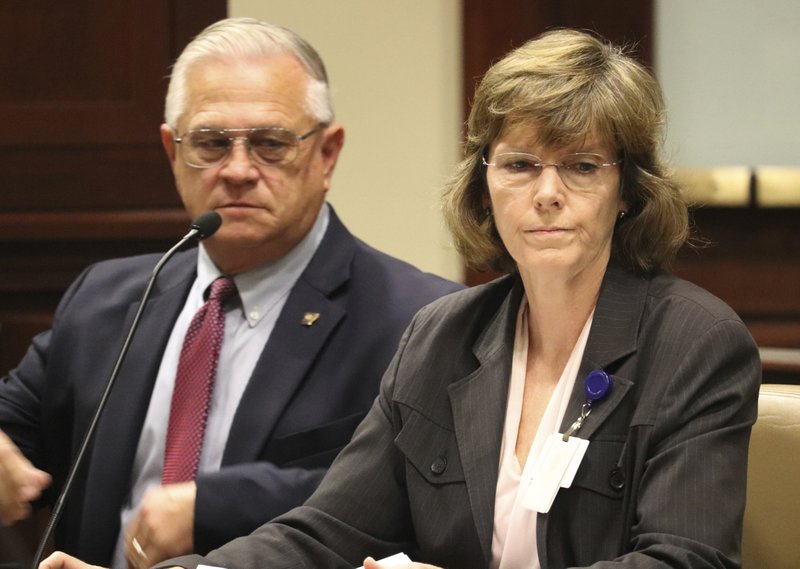 Correction Department Director Wendy Kelley testifies Wednesday, at a meeting of the Charitable, Penal and Correctional Institutions Subcommittee of the Arkansas Legislative Council in Little Rock, Ark. The panel is looking into a recent uptick in violence at the state's prisons. With Kelley is Dale Reed, the department's chief deputy director. (AP Photo/Kelly P. Kissel)