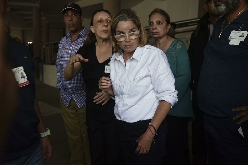 Mayor Carmen Yulin Cruz arrives at San Francisco hospital in Rio Piedras area of San Juan, Puerto Rico, Saturday, Sept. 30, 2017, as about 35 patients are evacuated after the failure of an electrical plant. 