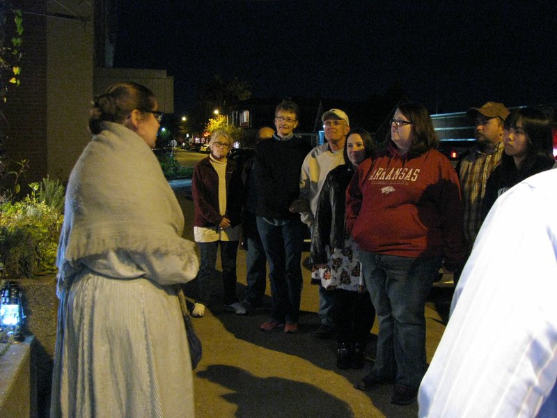 A costumed interpreter tells the story of Mary Bolin, the first murderess in Rogers, on a previous Rogers Historical Museum Ghost Walk.