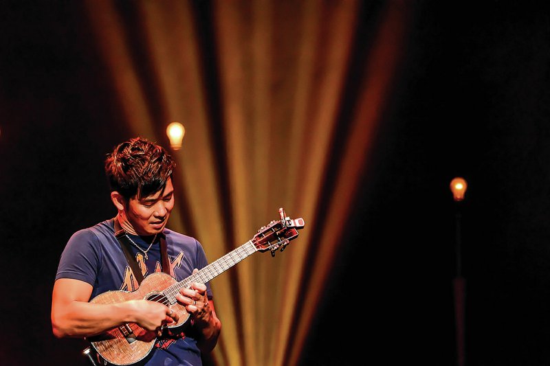 At Wednesday’s performance at the Walton Arts Center, listeners will find a balance between traditional and contemporary Hawaiian songs, as well as some popular pieces ukulele player Jake Shimabukuro has become known for adapting to his instrument. Songs like Leonard Cohen’s “Hallelujah,” Queen’s “Bohemian Rhapsody” and The Beatles’ “While My Guitar Gently Weeps” — the song that made Shimabukuro a viral YouTube sensation — are nearly always part of his set.