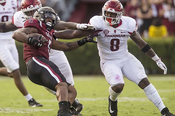 Arkansas linebacker De'Jon Harris (8) makes a tackle during a game against South Carolina on Saturday, Oct. 7, 2017, in Columbia, S.C. Arkansas linebacker De'Jon Harris (8) makes a tackle during a game against South Carolina on Saturday, Oct. 7, 2017, in Columbia, S.C.