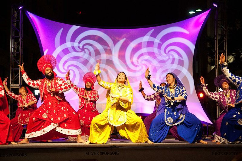 Pumjabi dancers perform Bhangra dance during San Antonio’s annual Diwali Festival, the largest city-sponsored Diwali celebration in the country. 
