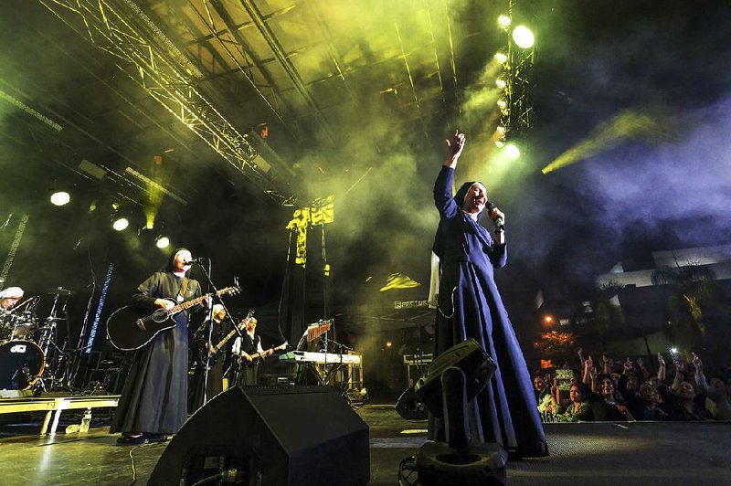 The rock band Siervas performs live last month at the Festival de Cristo at Christ Cathedral in Garden Grove, Calif. The band was formed in a Peruvian convent three years ago and since has gained an international following. 