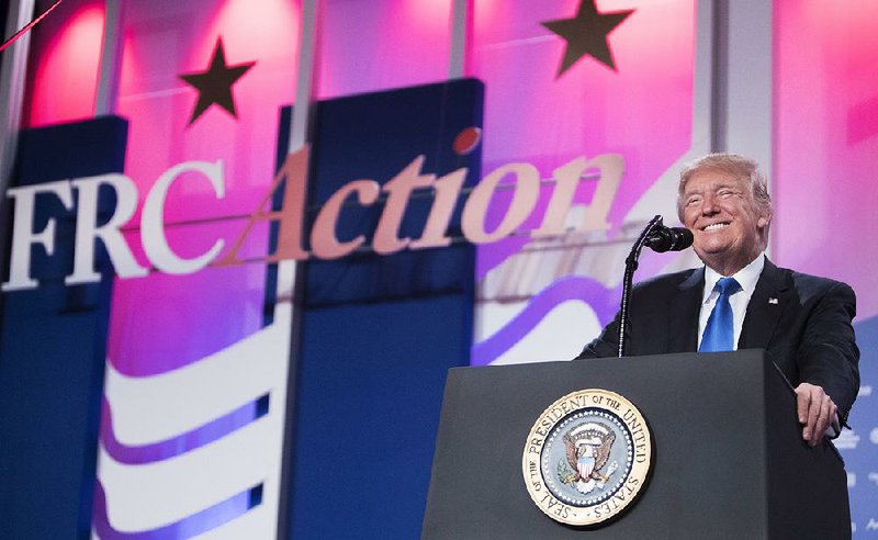President Donald Trump speaks Friday at the Values Voter Summit in Washington. He vowed to make “Merry Christmas” part of America’s discourse and proclaimed that in America “we don’t worship government. We worship God.”
