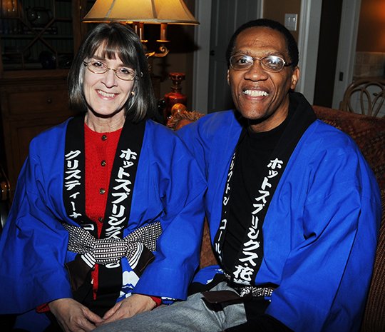 The Sentinel-Record/Mara Kuhn SISTER CITY CHAMPION: Clifton Coleman, right, shown with his wife, Kristina, at a reception for a Hanamaki, Japan, official in Hot Springs in 2013, died unexpectedly on Wednesday at the age of 66.