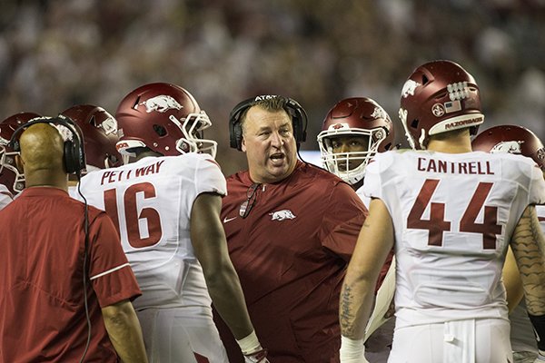 Arkansas coach Bret Bielema talks to players during a game against Alabama on Saturday, Oct. 14, 2017, in Tuscaloosa, Ala. 