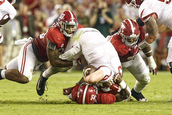 Arkansas quarterback Cole Kelley is sacked by Alabama linebacker Rashaan Evans (32) during a game Saturday, Oct. 14, 2017, in Tuscaloosa, Ala. 