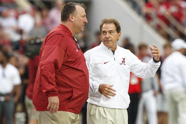 Arkansas coach Bret Bielema and Alabama coach Nick Saban chat during pregame, Saturday, Oct. 14, 2017.