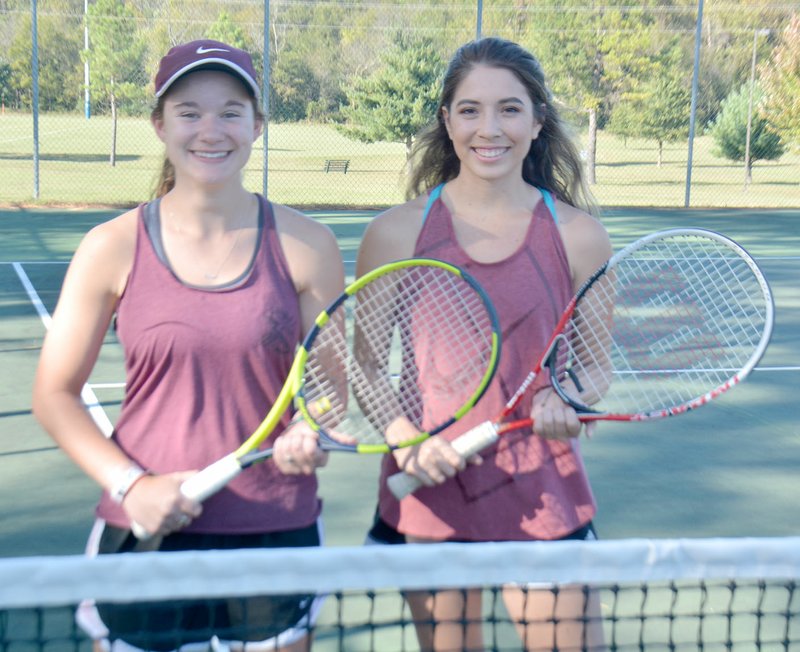 Graham Thomas/Siloam Sunday Siloam Springs senior girls doubles players Caroline Dinger, left, and Averie Headrick qualified for the Class 6A State Tennis Tournament, which begins Monday at Burns Park in North Little Rock.