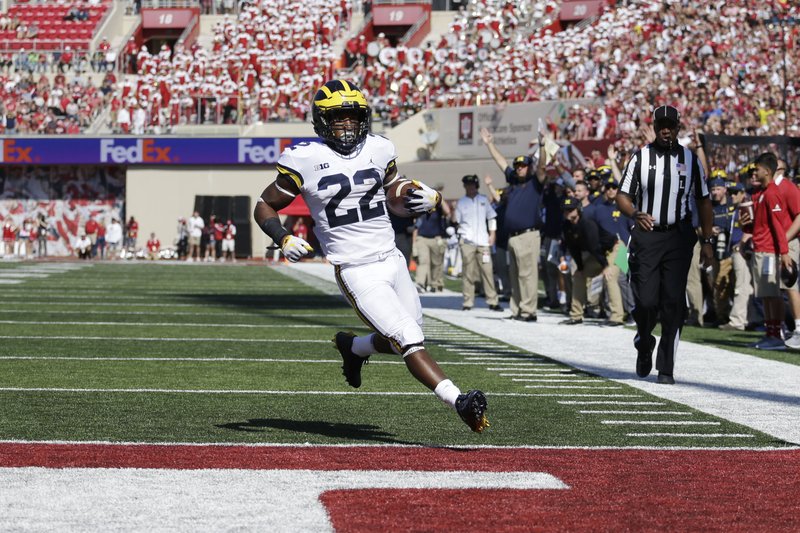 Michigan running back Karan Higdon scores a touchdown during the first half an NCAA college football game against Indiana in Bloomington, Ind., Saturday, Oct. 14, 2017. (AP Photo/AJ Mast)