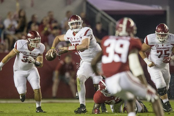 Arkansas quarterback Cole Kelley scrambles while looking downfield in a 41-9 loss at Alabama Saturday, Oct. 14, 2017, at Bryant-Denny Stadium in Tuscaloosa, Ala. 
