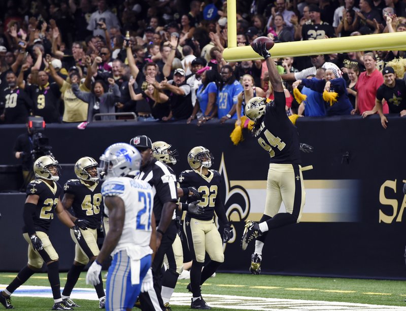 New Orleans Saints defensive end Cameron Jordan (94) celebrates his touchdown after interception in the end zone in the second half of an NFL football game against the Detroit Lions in New Orleans, Sunday, Oct. 15, 2017. 