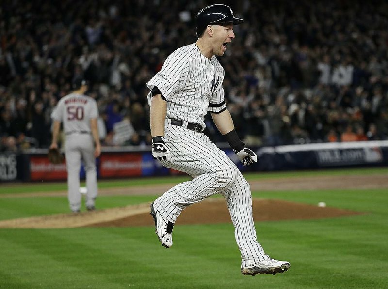 Todd Frazier of the New York Yankees rounds the bases after hitting a three-run home run off Houston Astros starter Charlie Morton during the third inning of Game 3 of the American League Championship Series on Monday night in New York. The Yankees defeated the Astros 8-1 to cut Houston’s series lead to 2-1.