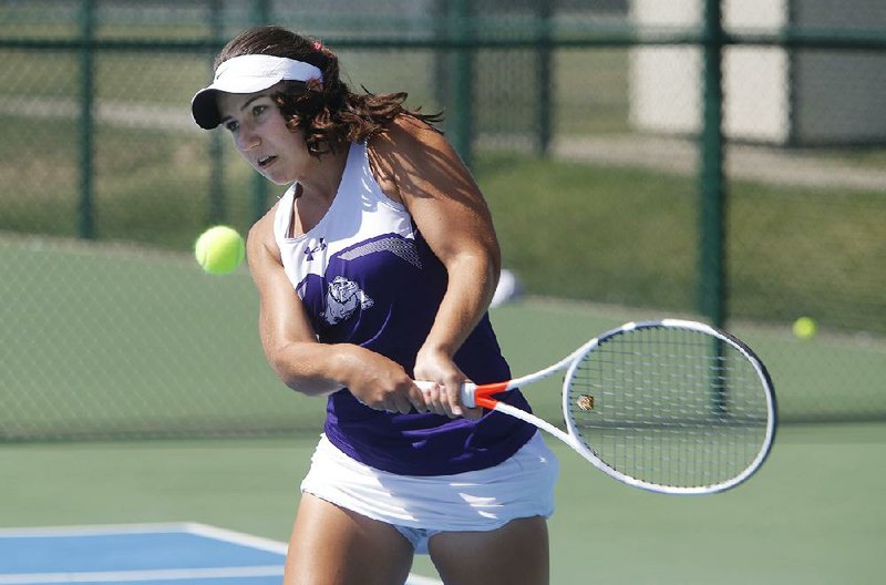Fayetteville High School's Mary Houston competes Friday, October 6, 2017, in the 7A-West Conference tennis tournament at Springdale Har-Ber High School tennis courts in Springdale. Houston was playing against Rogers High School's Erica Jaggernauth.