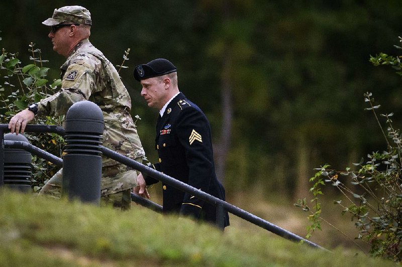 Sgt. Bowe Bergdahl (right) arrives for a motions hearing on Monday on Fort Bragg, N.C.