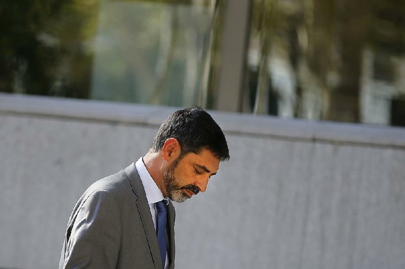 Catalan police chief Josep Lluis Trapero leaves the national court during a break Monday in Madrid, Spain.
