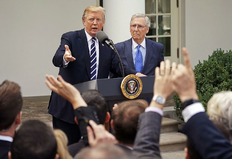 President Donald Trump and Senate Majority Leader Mitch McConnell speak to reporters Monday in the Rose Garden of the White House.