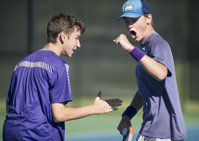 Jack Mason and Jackson Runnels of Fayetteville High School react following a score during the Class 7A state boys tennis tournament on Monday at the Memorial Park tennis facility in Bentonville.