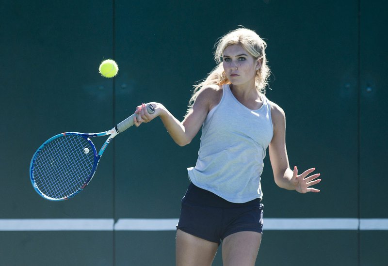Bentonville West's Sarah Schneringer swings a forehand during the Class 7A state girls tennis tournament on Monday, October 16, 2017 at Memorial Park tennis facility in Bentonville.