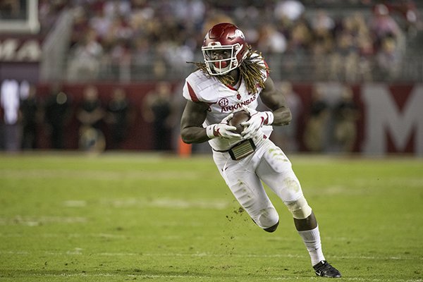 Arkansas receiver Brandon Martin runs after a catch during a game against Alabama on Saturday, Oct. 14, 2017, in Tuscaloosa, Ala. 