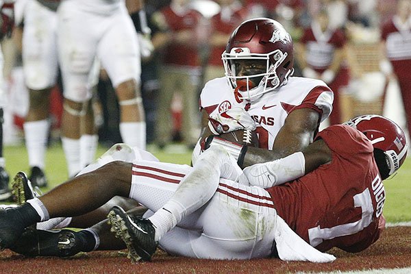 Arkansas wide receiver Jordan Jones scores a touchdown against Alabama defensive back Trevon Diggs during the second half an NCAA college football game, Saturday, Oct. 14, 2017, in Tuscaloosa, Ala. (AP Photo/Brynn Anderson)

