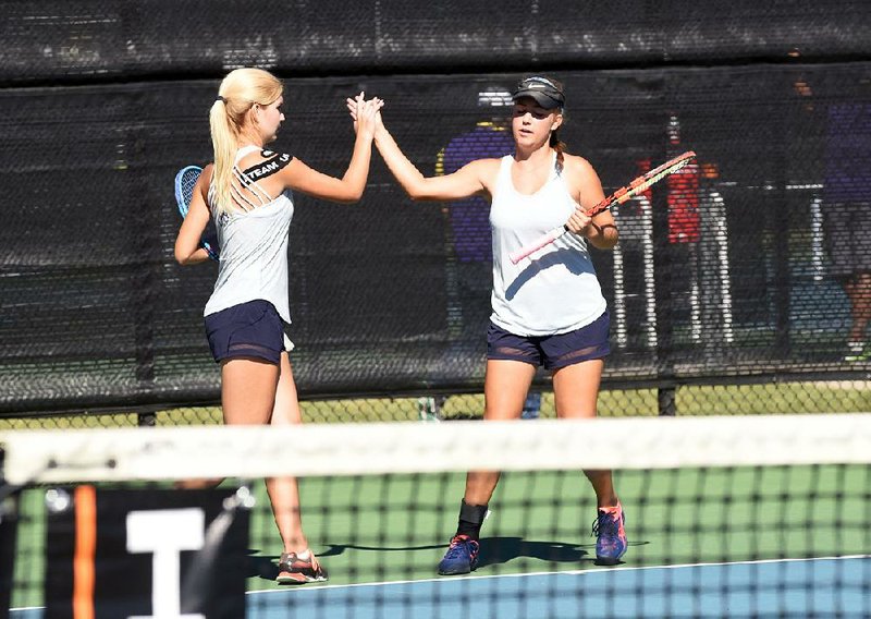Bentonville West players Avery Hargrove (left) and Sarah Schneringer won the Class 7A state girls doubles championship when they defeated Fayetteville’s Cam Cupelli and Anna Mauromoustakos 6-4, 6-4. 