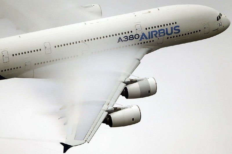Vapor forms on the wing of an Airbus A380 during a demonstration flight at the 2015 Paris Air Show. Airbus has agreed to buy a majority stake in Bombardier Inc.’s C Series program and will start assembling the jetliner in the U.S. 