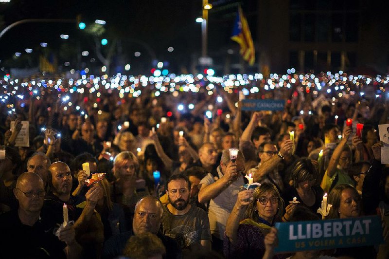 Catalans protest Tuesday in Barcelona, Spain, against a Madrid judge’s decision to imprison separatist leaders without bail. 