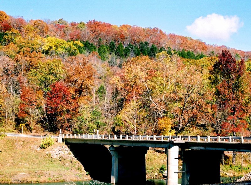 RANDY MOLL WESTSIDE EAGLE OBSERVER The colors of fall can be viewed in parks a short distance away, such as this view in Devil's Den State Park near West Fork. The state's website says peak colors in Northwest Arkansas should be late October/early November.