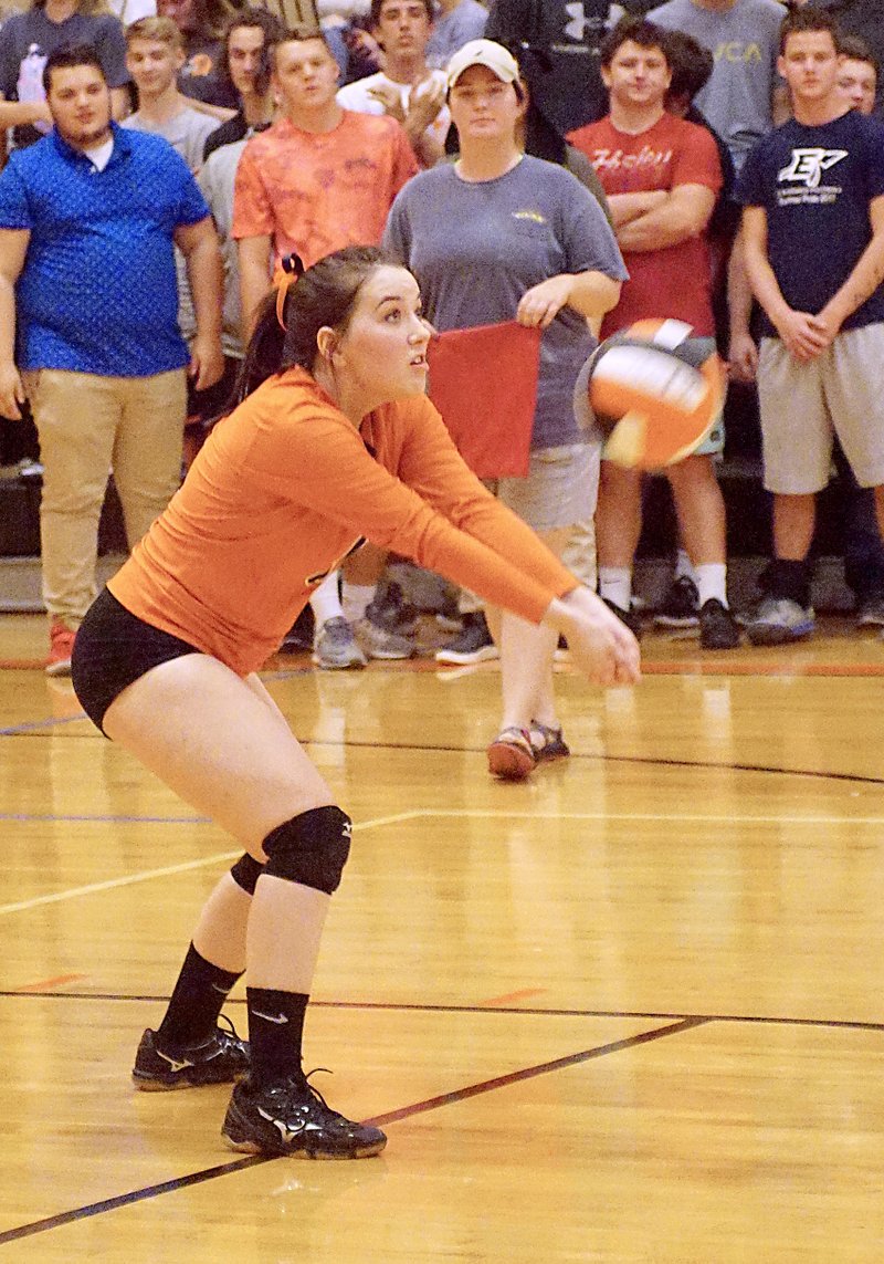 Photo by Randy Moll Kaylee Midyett, a Gravette junior, receives a serve during the final regular season game against the Lady Lions at Gravette High School on Thursday (Oct. 12, 2017).
