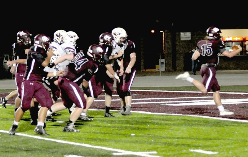 MARK HUMPHREY ENTERPRISE-LEADER Lincoln junior Caleb Lloyd runs untouched into the end zone to score a key 2-point conversion as the Wolves got ahead of Huntsville, 35-28, late in the fourth quarter Friday.