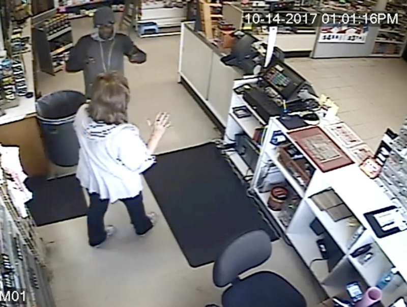 COURTESY FARMINGTON POLICE DEPARTMENT This still shot was taken from the surveillance camera showing an armed robbery that took place at 1 p.m. Saturday at Discount Tobacco in Farmington.