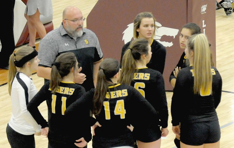 MARK HUMPHREY ENTERPRISE-LEADER/Prairie Grove coach Mat Stewart takes time-out to get the Lady Tiger volleyball team reorganized during a match at Lincoln. The Lady Tigers competed in the district tournament this week at Lincoln.