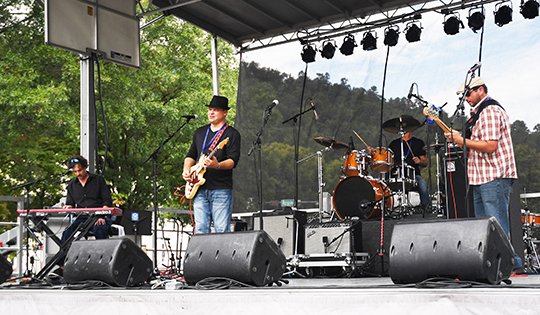 The Sentinel-Record/File photo BLUES FEST: The John Calvin Brewer Band performs during the Spa City Blues Festival at Hill Wheatley Plaza on Sept. 2.
