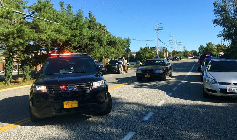 Police and emergency medical services respond to a shooting at a business park in the Edgewood area of Harford County, Md., on Wednesday, Oct. 18, 2017. 