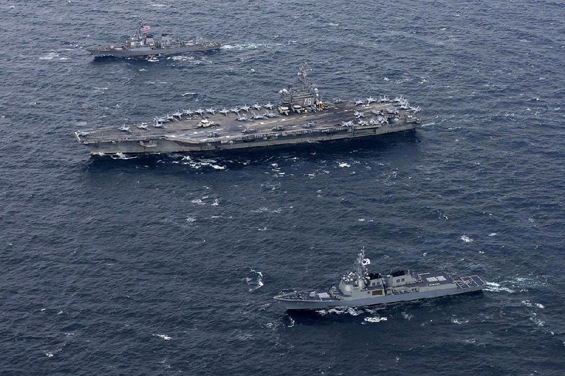The aircraft carrier USS Ronald Reagan cruises with U.S. and South Korean vessels Wednesday during joint maneuvers in waters east of the Korean Peninsula. 
