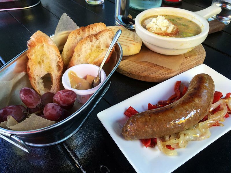 Pairing the Italian Sausage and Peppers and the Southern Table Cheese Soup makes a good-size meal from a menu that focuses on “bites” rather than fullsize dishes. 