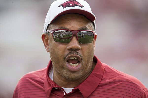 Arkansas inside linebackers coach Vernon Hargreaves watches warmups prior to a game against South Carolina on Saturday, Oct. 7, 2017, in Columbia, S.C.