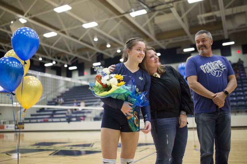 NWA Democrat-Gazette/CHARLIE KAIJO Bentonville West High School libero Lauren Hawks (11) is honored for "Senior Night" during the girl's volleyball game on Thursday, October 12, 2017 at Bentonville West High School in Centerton. 