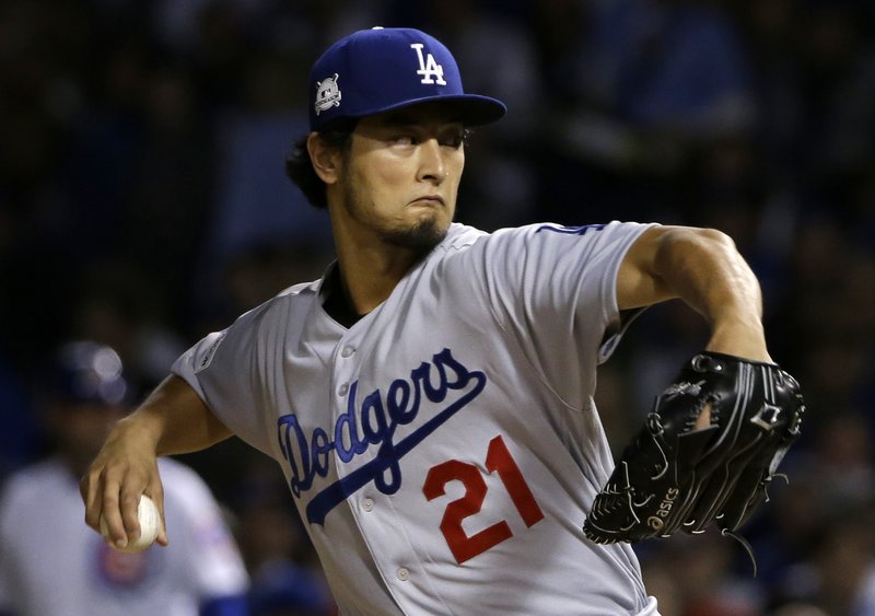 Los Angeles Dodgers starting pitcher Yu Darvish (21) throws during the first inning of Game 3 of baseball's National League Championship Series against the Chicago Cubs, Tuesday, Oct. 17, 2017, in Chicago. (AP Photo/Nam Y. Huh)