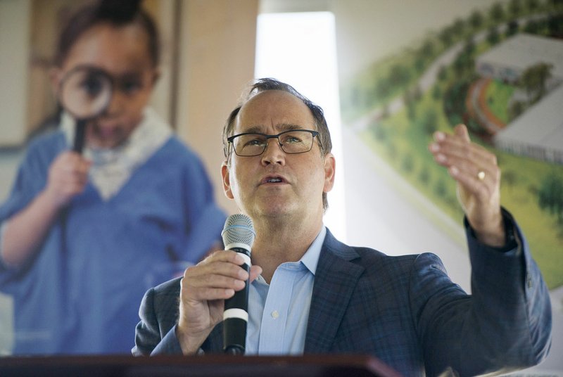 NWA Democrat-Gazette/CHARLIE KAIJO Kyle Peterson director of the Walton Family Foundation, speaks Thursday in front of Crystal Bridges in Bentonville. The Helen Walton Children's Enrichment Center broke ground on its new facility in Bentonville.