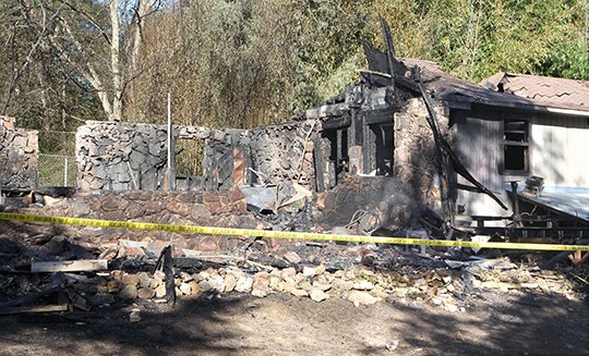 The Sentinel-Record/Richard Rasmussen GUTTED: The remains of a home at 115 Cleo St. in Royal following a structure fire that occurred shortly after 10 p.m. Tuesday.